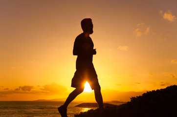 Silhouette of young man running
