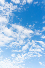 Bright sunny day with clouds. Cloudscape on blue sky. Soft focus