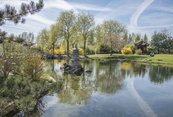 Chinese Garden of the Reclaimed Moon. Lake with stone laterne