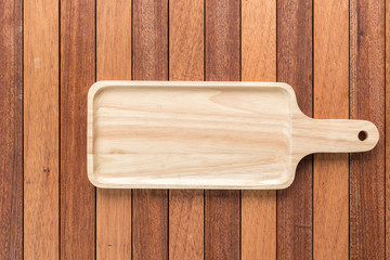 Empty wooden tray on wooden table