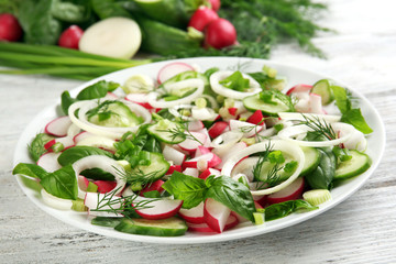 Fresh vegetable salad on table close up