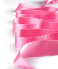 Pink silk ribbon isolated on white