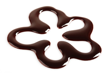 Silhouette of drawn chocolate flower, isolated on white