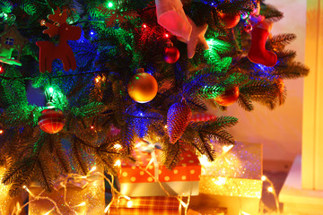 Fototapeta na wymiar Christmas tree in a room closeup