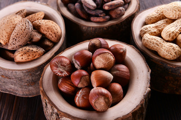 Assortment of tasty nuts on wooden background