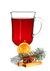 Mulled wine with spices on a table isolated on white