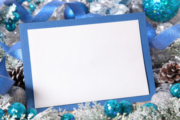 Blank Christmas card with blue envelope and decoration
