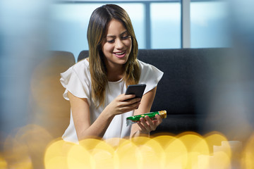 Woman Scans Barcode On Food Label Pack With Phone