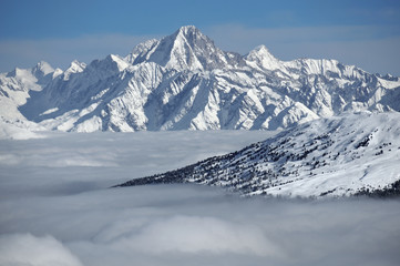 Naklejka premium Bietschhorn, in the Swiss Alps above a layer of clouds