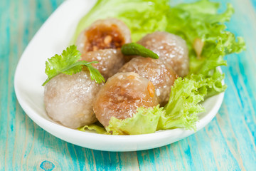 Tapioca Balls with Pork Filling and Paprika on Lettuce