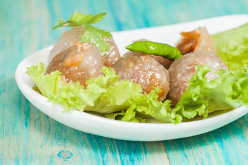 Tapioca Balls with Pork Filling and Paprika on Lettuce