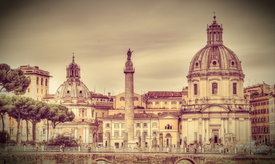 Fototapeta na wymiar View of Church of Santa Maria di Loreto and Trajan's Column. Rome, Italy. Retro toned photo.