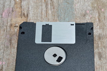 floppy disk on wooden board