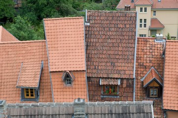Fototapeta na wymiar Red roof houses in the medieval city Quedlinburg in Germany
