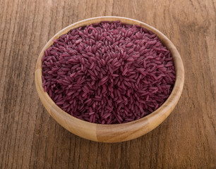 Purple rice in a wooden bowl