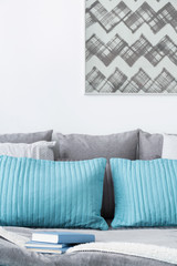 Decorative turquoise and grey cushions