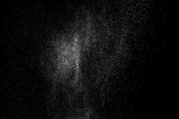 Fototapeta na wymiar abstract splashes of water on a black background. splashes of milk. abstract spray of water. abstract rain. shower water drops. white dust explosion. abstract texture. abstract black background.