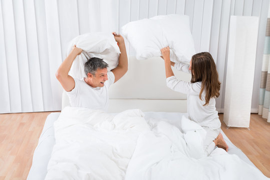 Couple Fighting With Pillow