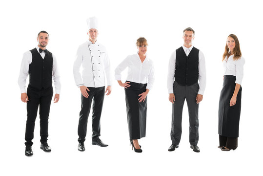 Happy Restaurant Staff Standing Over White Background