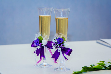 Decorated crystal wedding glass with champagne on the table