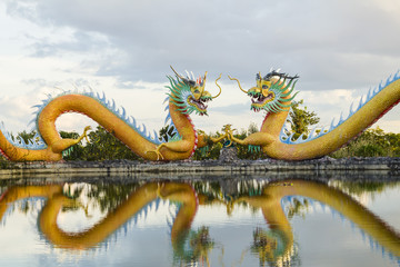 Colorful twins dragon statue with beautifully blue sky at public park 