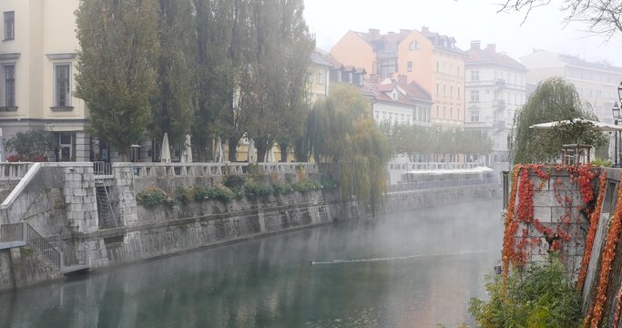 Ljubljanica river and buildings in the background