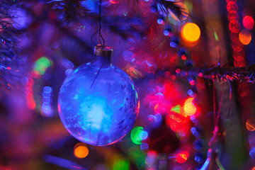 Christmas ball in the Christmas tree with bokeh color lights background. Soft and selective focus - 95791274