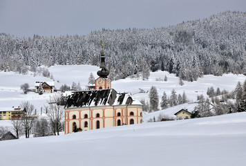 Catholic church on a winter background, Austria