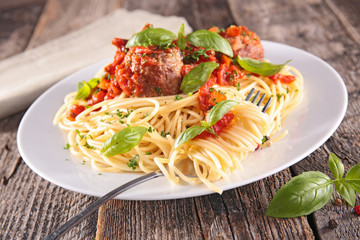 plate of spaghetti with meatball and tomato sauce