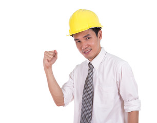 Happy young engineer celebrating with arm raised, concept of suc