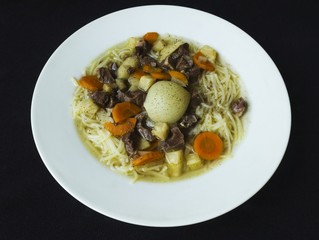 soup made from pork heart on a white plate