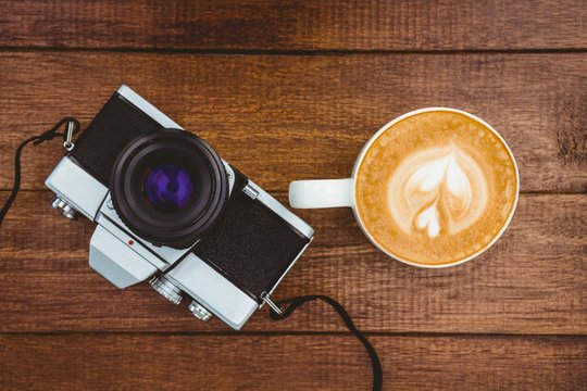 View of an old camera with coffee