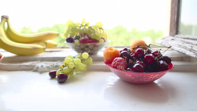 different Summer fruits on a window sill