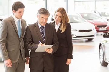 Group of smiling business team standing together