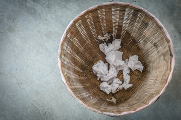 Crumpled paper in the trash can