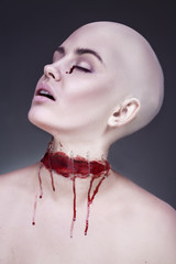 Horrible scary zombie woman. Halloween makeup.