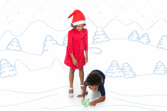 siblings with christmas hat play in a winter drawing landscape