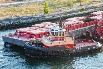Tug Pushing Barge by Dock