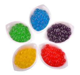 Colorful fruit jellies on white background