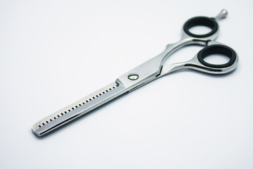 professional scissors for haircuts on white background