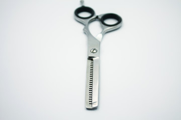 professional scissors for haircuts on white background