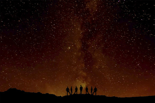 Group Of People Silhouette, With Sky At Night With Stars On Background, Brilliant Background; Similar To The Eruption Of A Volcano, Abstract Photography