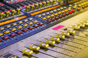 studio mixer detail  with backlit buttons, selective focused