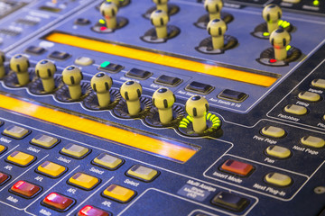 studio mixer detail  with backlit buttons, selective focused