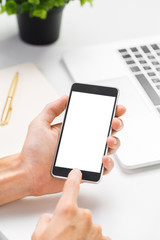 Cropped shot of a man's hands using a laptop at home