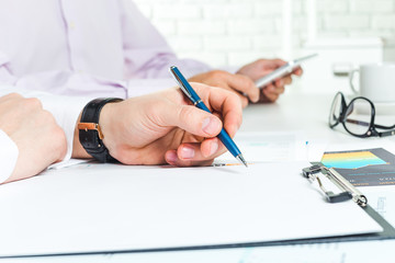 Two businessmen discussing some project