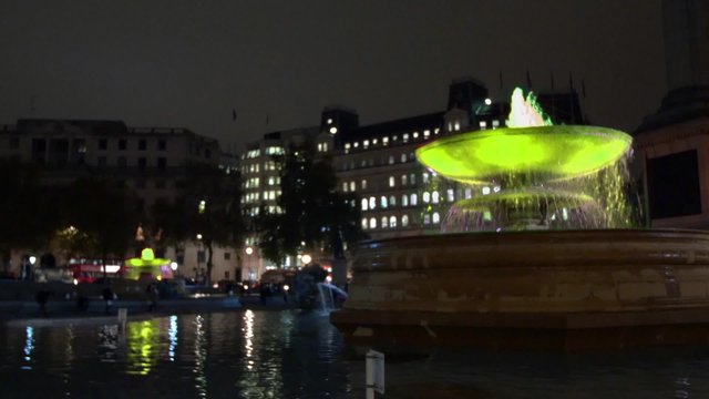 London, Trafalgar square, view of fountais at night shifting colour
