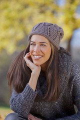 Autumn in the park, Young smiling woman relaxing in nature