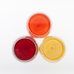 Wine bar, three glasses of wine unusual perspective on white background.