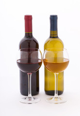 Glasses and bottles of wine unusually on white background.